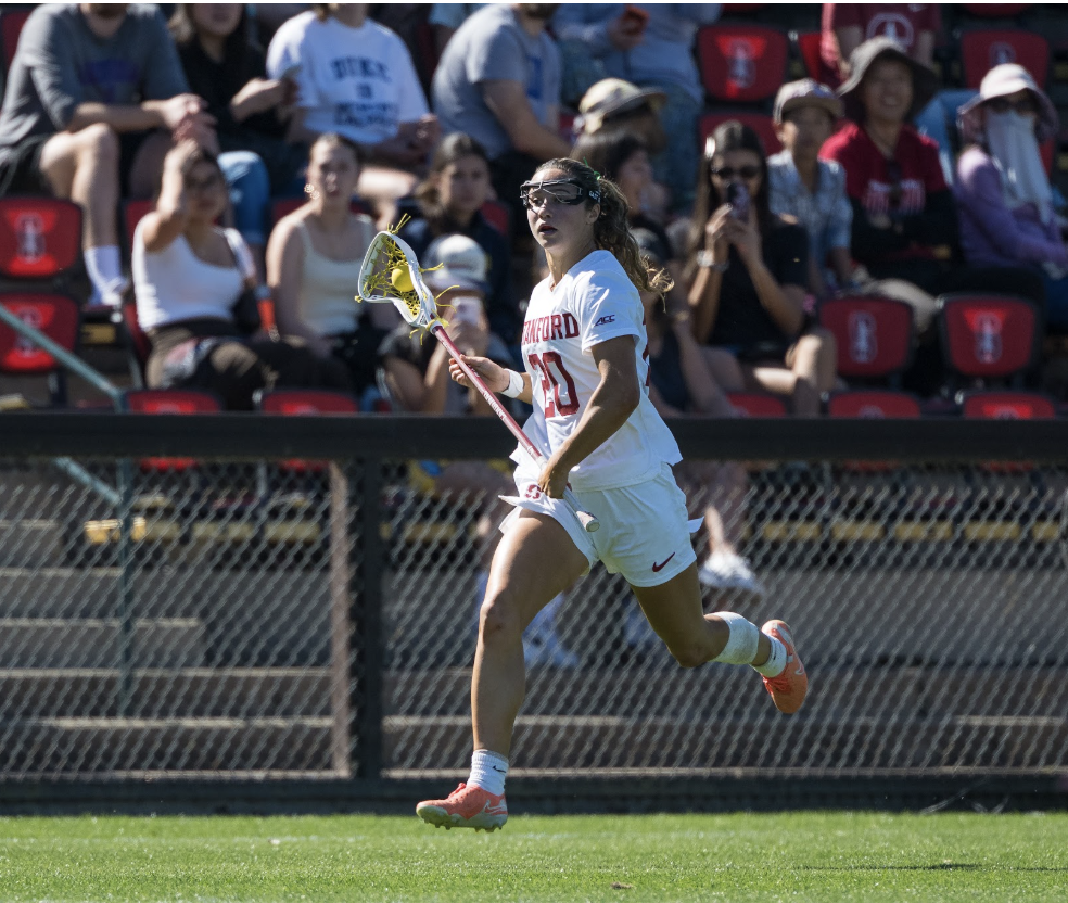 Anna Colpack running during a Stanford lacrosse game