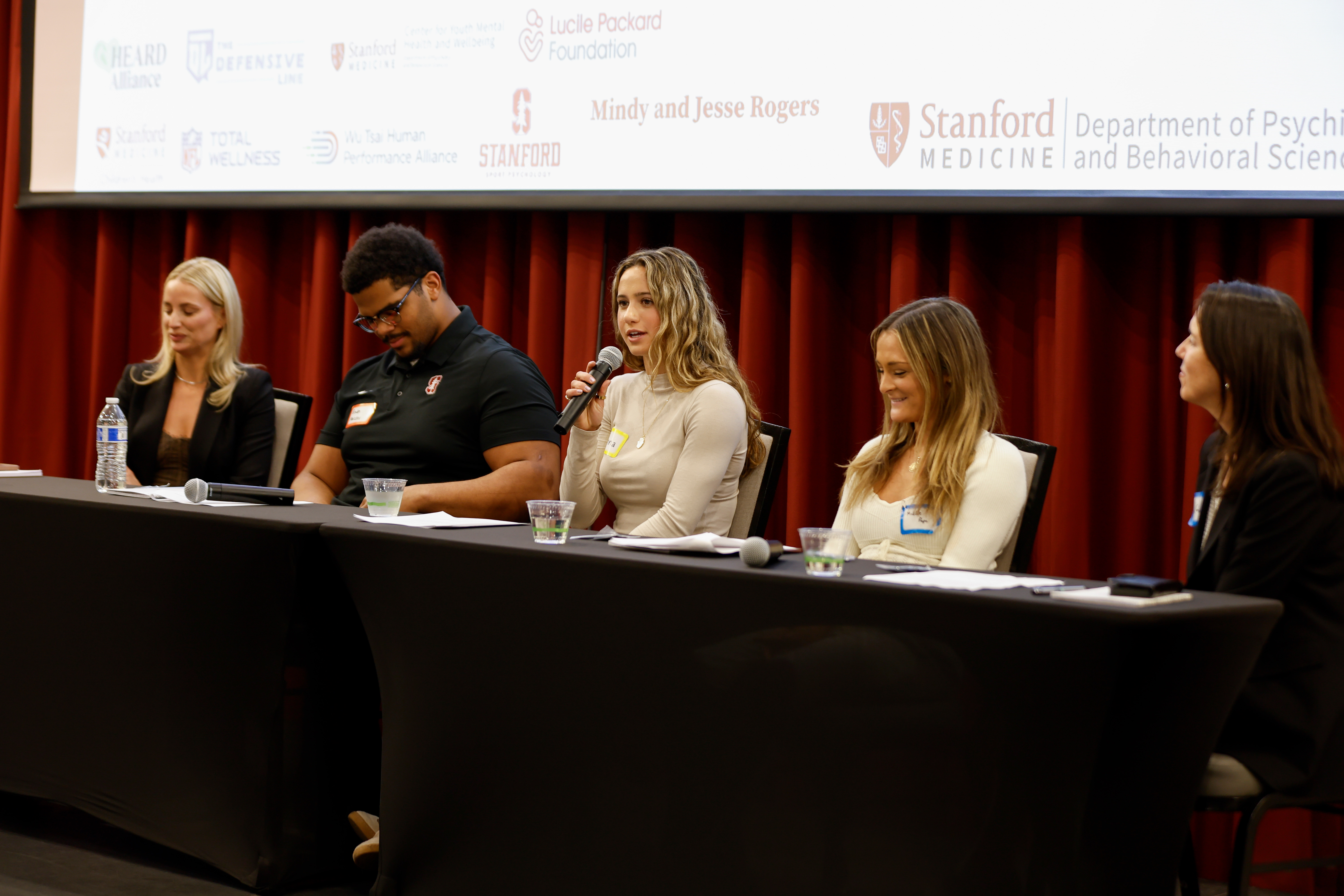 Anna Colpack speaking on a youth sports and mental health panel